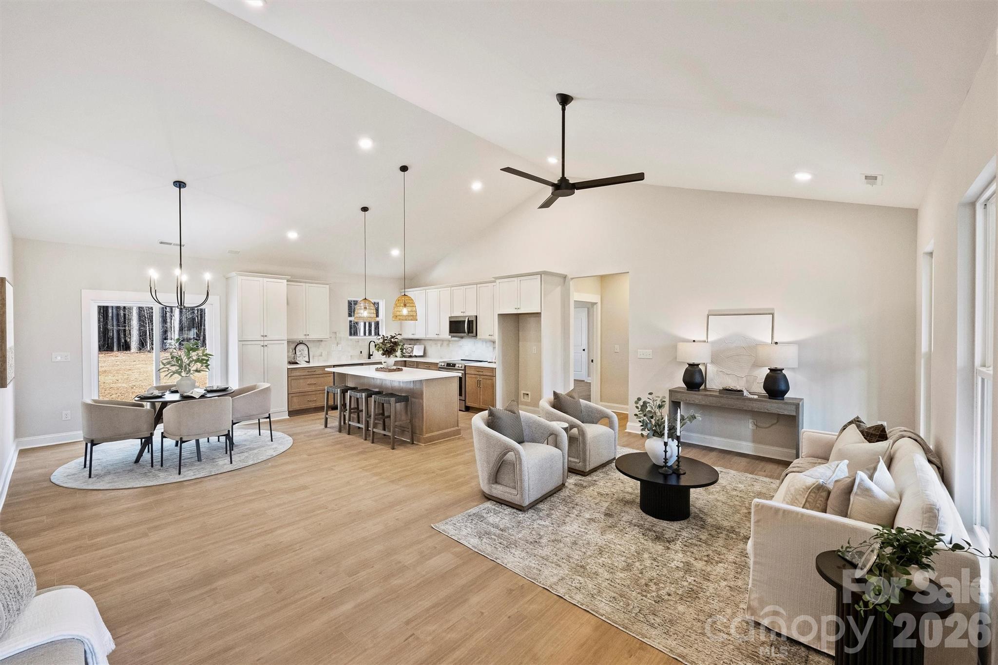 2307 Lee Lawing Road Lincolnton, NC 28092 - Photo 8 of 42 a living room with kitchen island furniture and a chandelier
