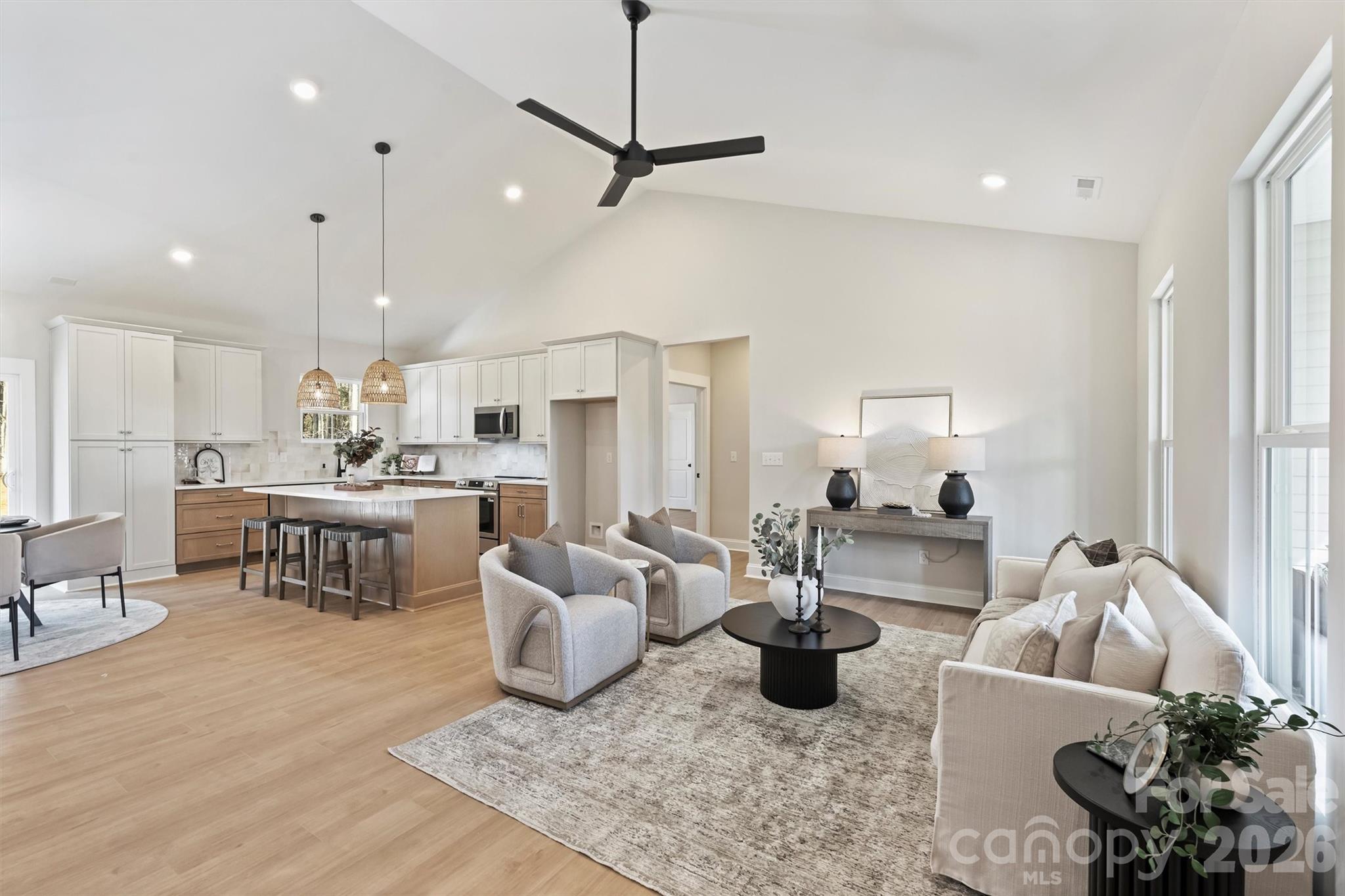 2307 Lee Lawing Road Lincolnton, NC 28092 - Photo 9 of 42 a living room with kitchen island furniture and a chandelier