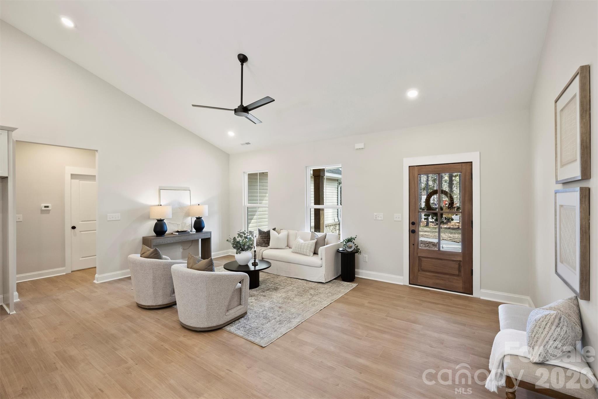 2307 Lee Lawing Road Lincolnton, NC 28092 - Photo 10 of 42 a living room with furniture a window and a table