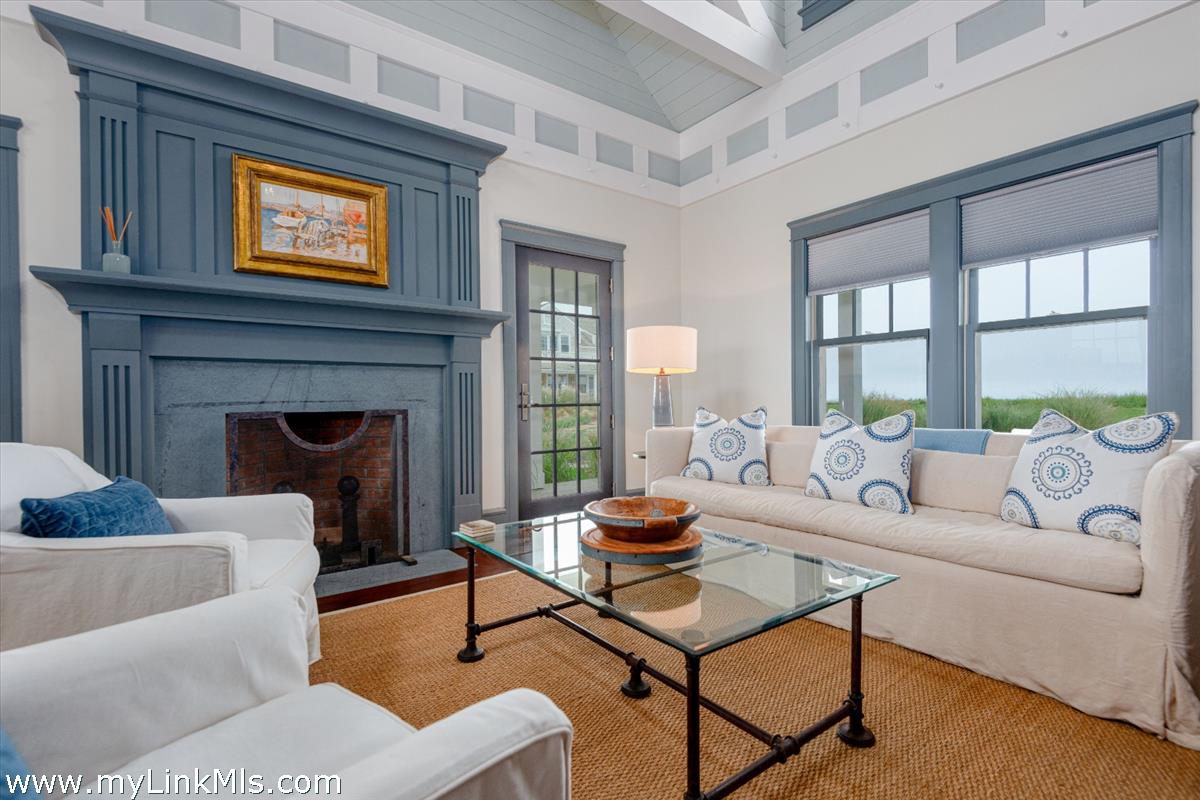 37 Sankaty Head Road Nantucket, MA 02554 - Photo 55 of 65 a living room with furniture and a fireplace