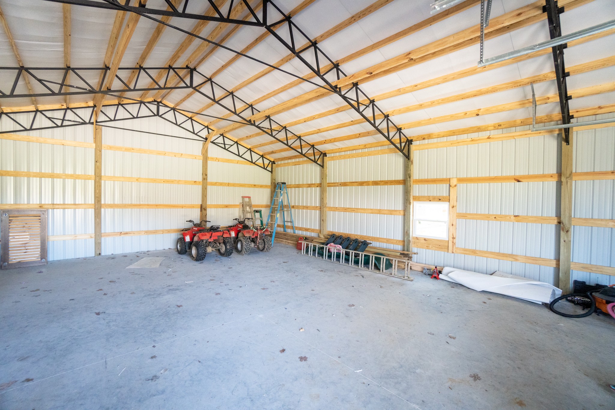 2017 Carpenter Bridge Road Columbia, TN 38401 - Photo 5 of 36 a view of a garage with a table and chairs and a large window