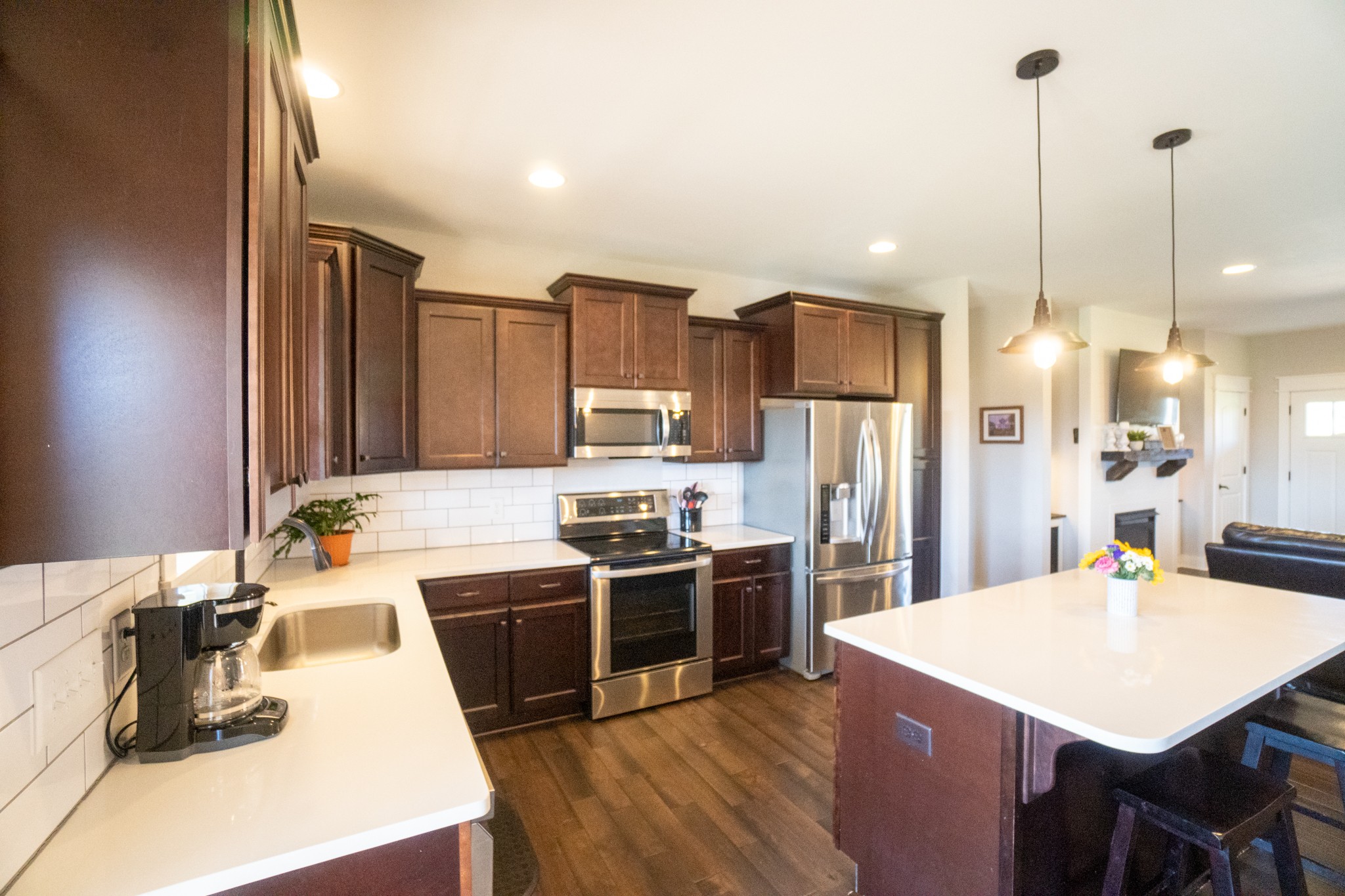 2017 Carpenter Bridge Road Columbia, TN 38401 - Photo 10 of 36 a kitchen with stainless steel appliances kitchen island granite countertop a sink a stove a refrigerator and island with wooden floor