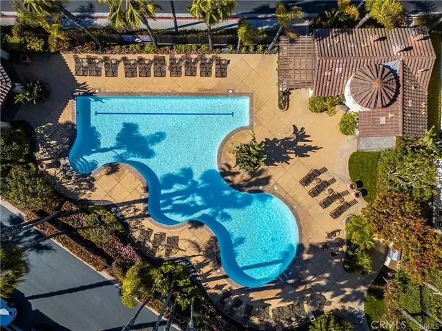 an aerial view of a fireplace with table and chairs