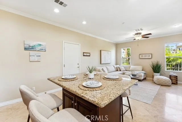 a view of a dining room with furniture and a chandelier