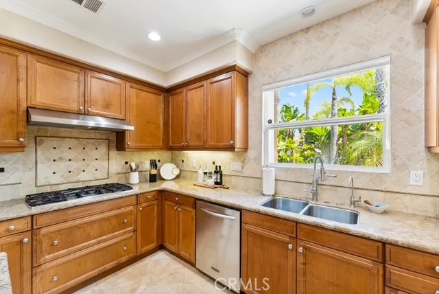 a kitchen with a sink stove and window