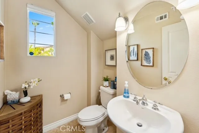 a hallway with furniture and a large window