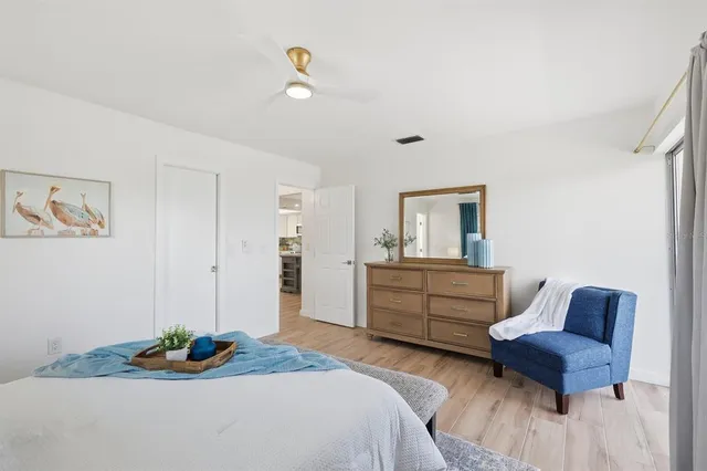 a bedroom with a bed and a couch