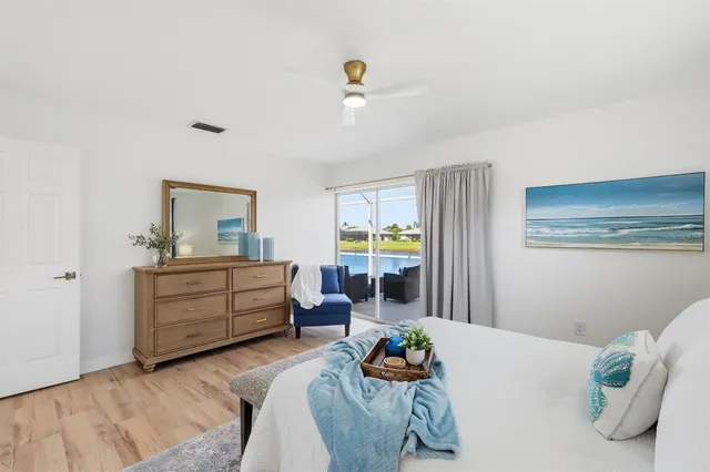 a bedroom with furniture and a window