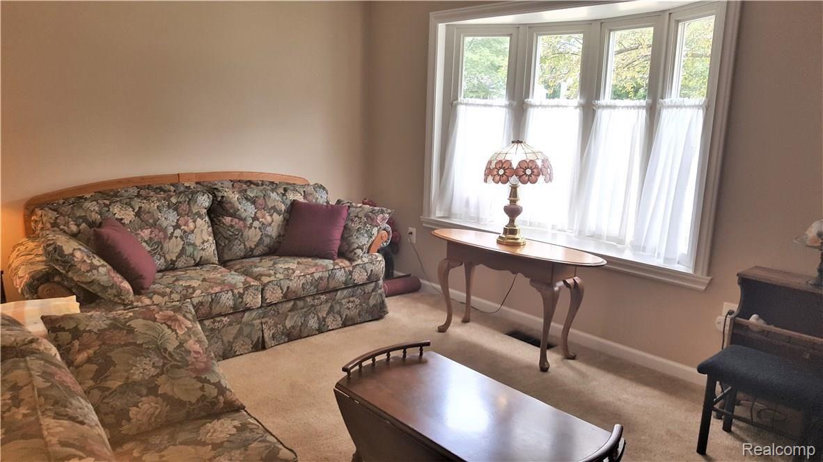 Living room with bow window.