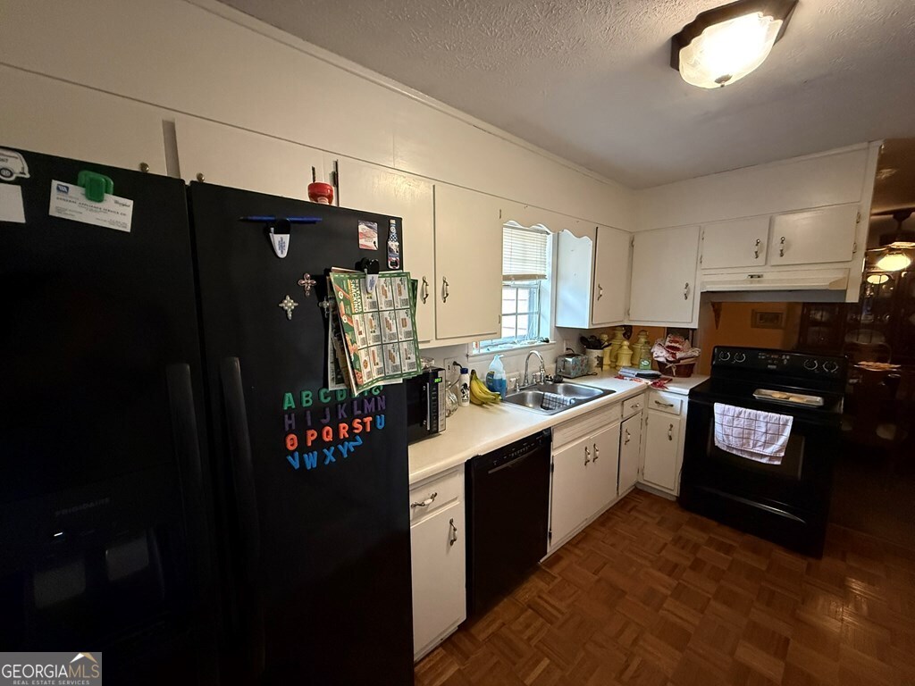 1158 Holly Grove Circle Northeast Dalton, GA 30721 - Photo 20 of 20 a kitchen with a sink stove and refrigerator