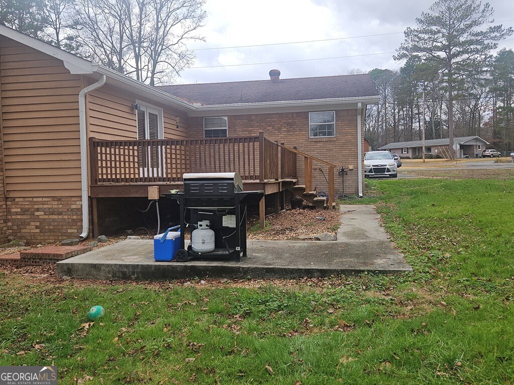 1158 Holly Grove Circle Northeast Dalton, GA 30721 - Photo 2 of 20 a view of a house with backyard and trees