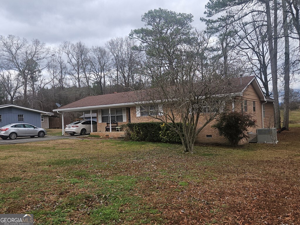 1158 Holly Grove Circle Northeast Dalton, GA 30721 - Photo 5 of 20 a view of a house with a yard