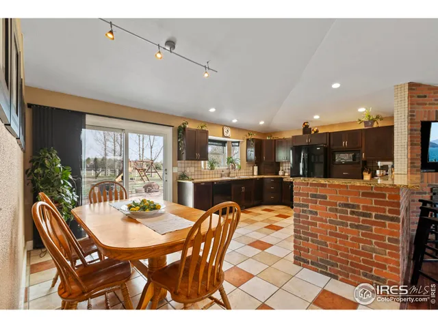 a outdoor dining space with furniture and kitchen view