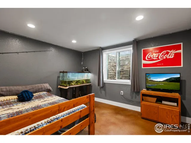 a kitchen with stainless steel appliances kitchen island granite countertop a refrigerator and a stove