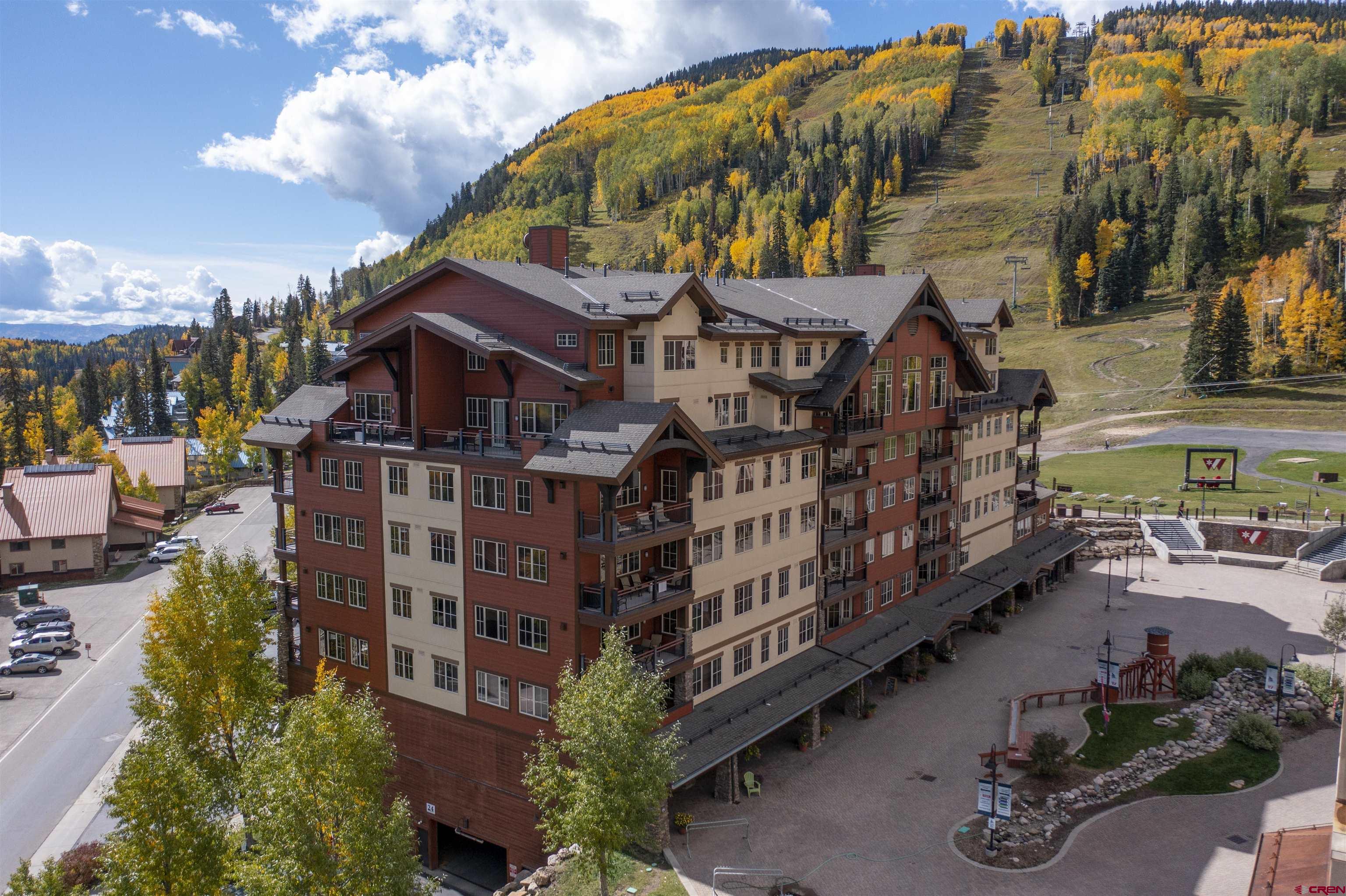a aerial view of a house with balcony and garden