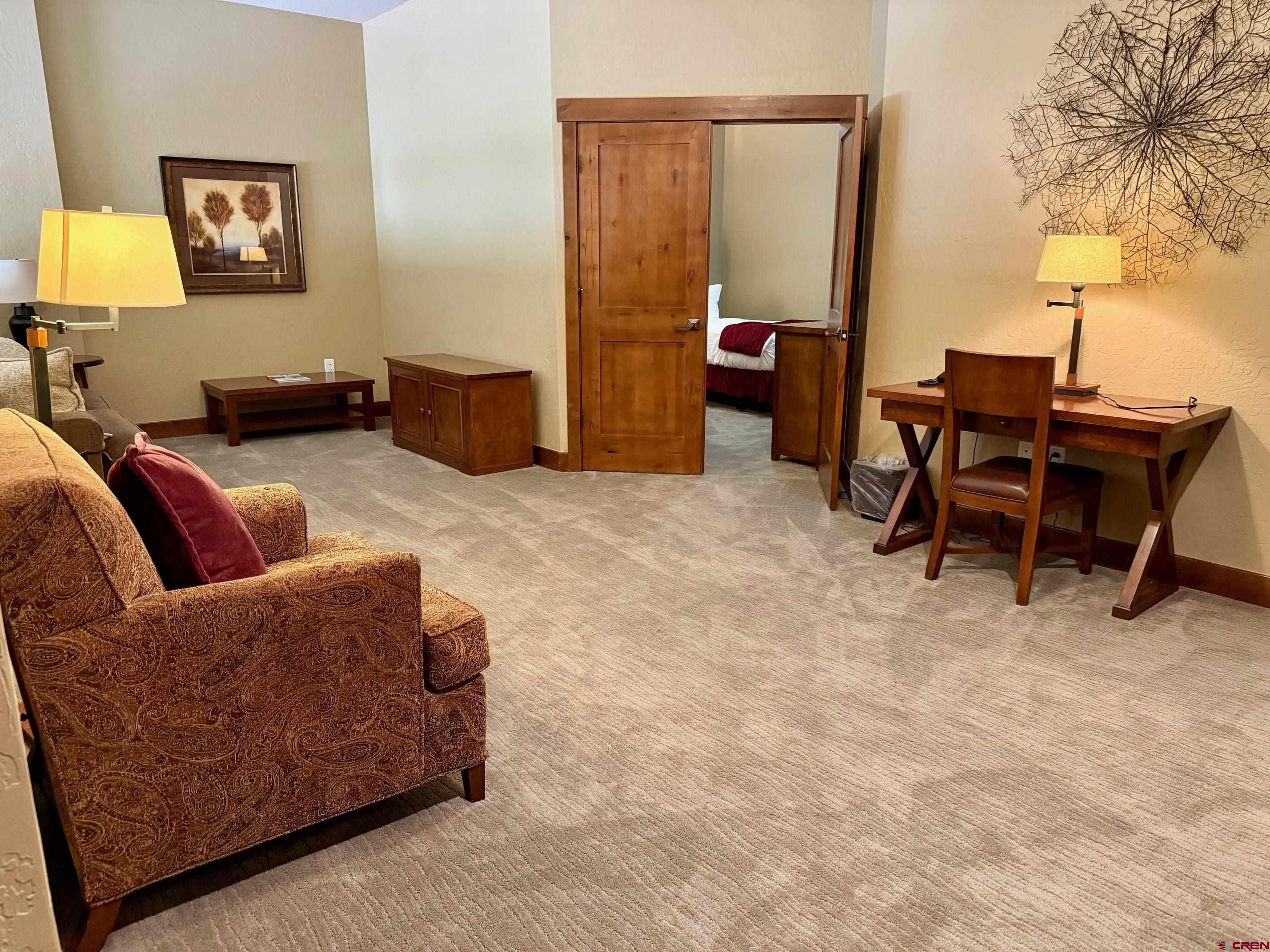 24 Sheol Street, Unit 506 Durango, CO 81301 - Photo 42 of 45 a living room with furniture and a lamp
