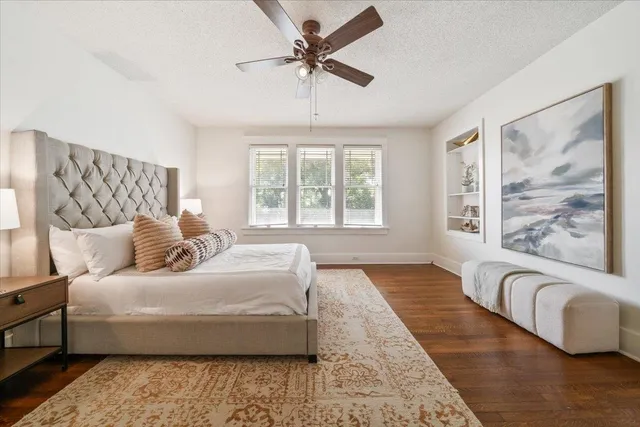 a bedroom with a large bed and a couch