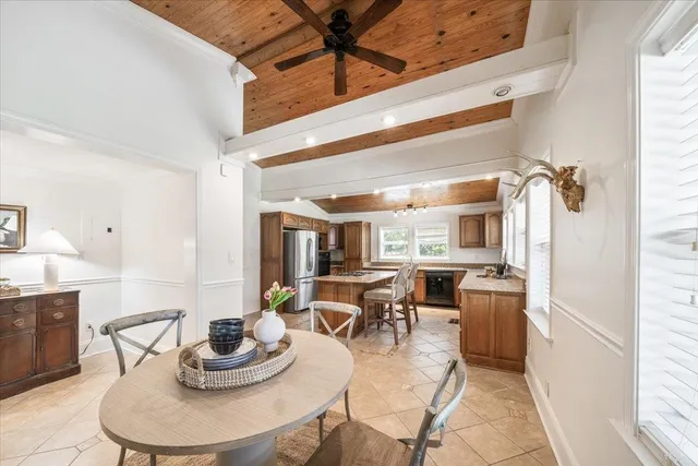 a living room with furniture a window and kitchen view