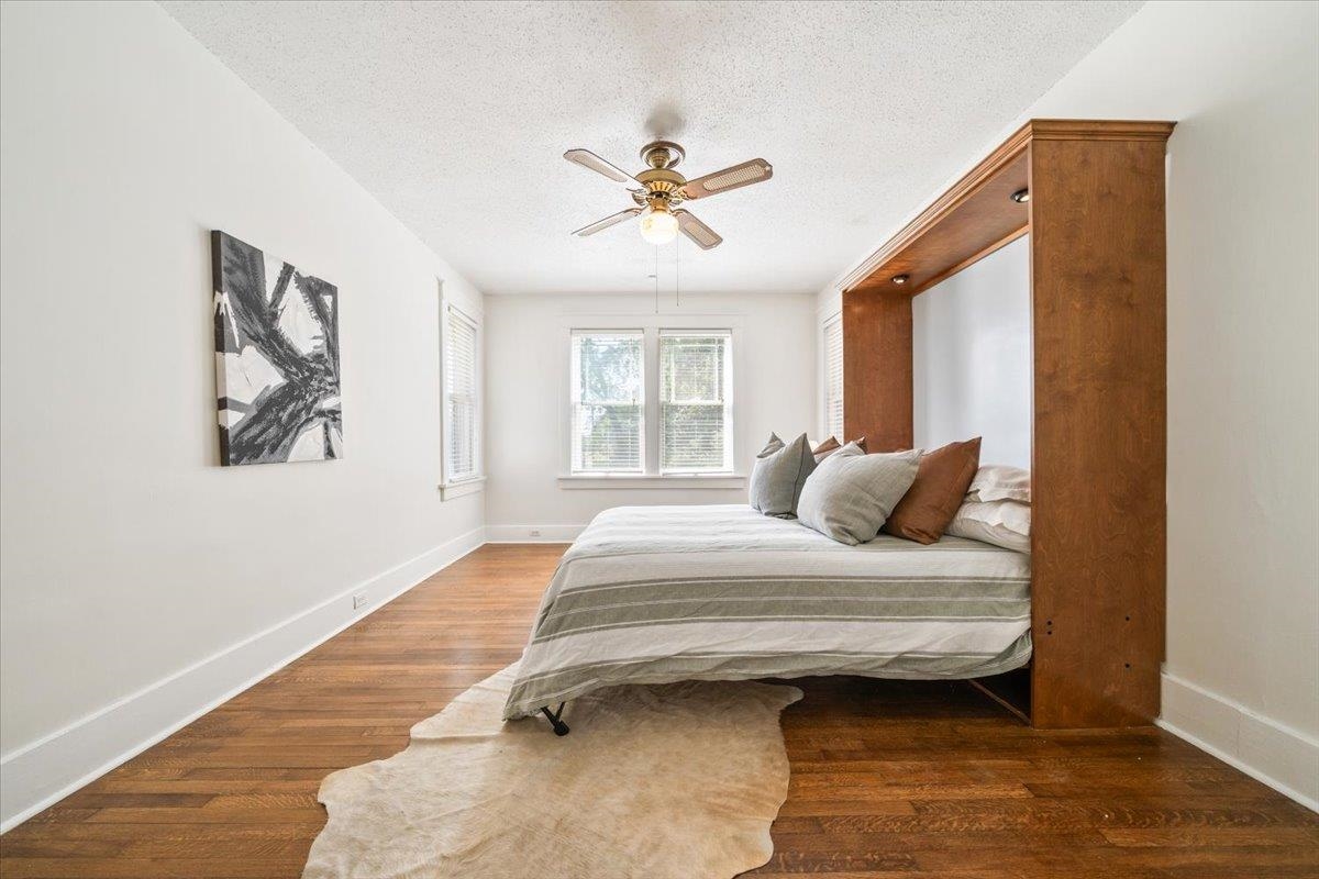 8703 Rosemark Road Millington, TN 38053 - Photo 21 of 38 a bedroom with a bed wooden floor and window