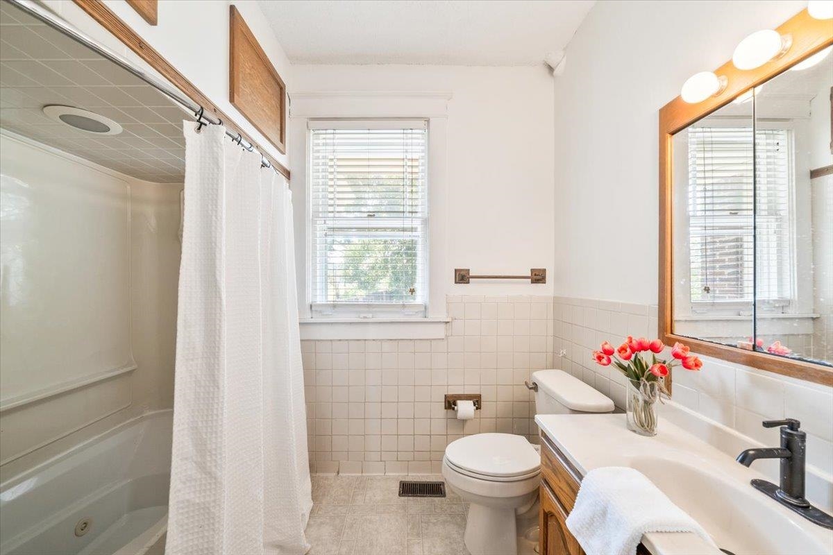 8703 Rosemark Road Millington, TN 38053 - Photo 24 of 38 a bathroom with a sink toilet and a mirror