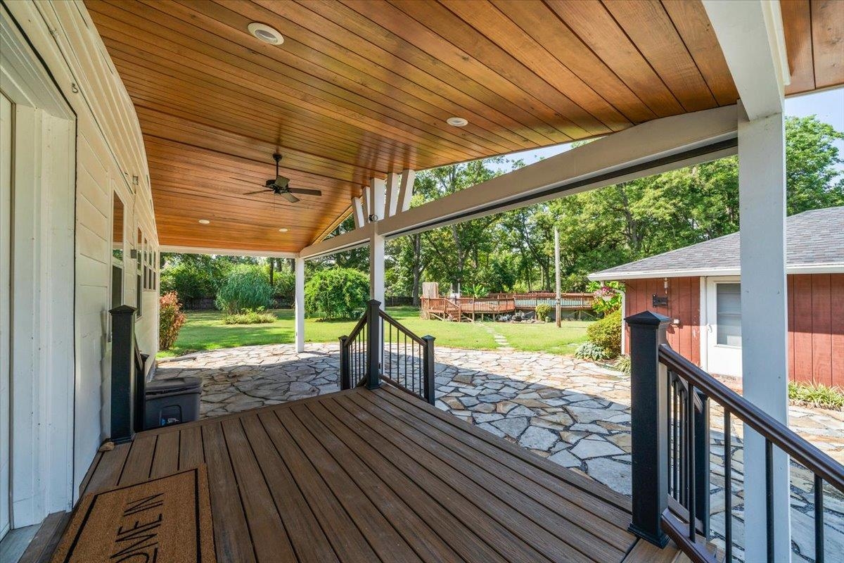 8703 Rosemark Road Millington, TN 38053 - Photo 26 of 38 a view of a deck with wooden floor next to a yard