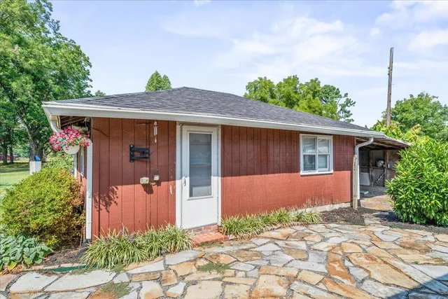 a front view of a house with garden