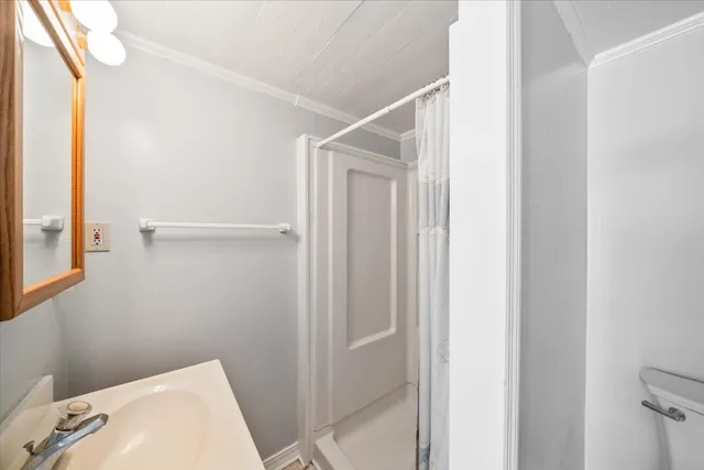 a bathroom with a shower and toilet