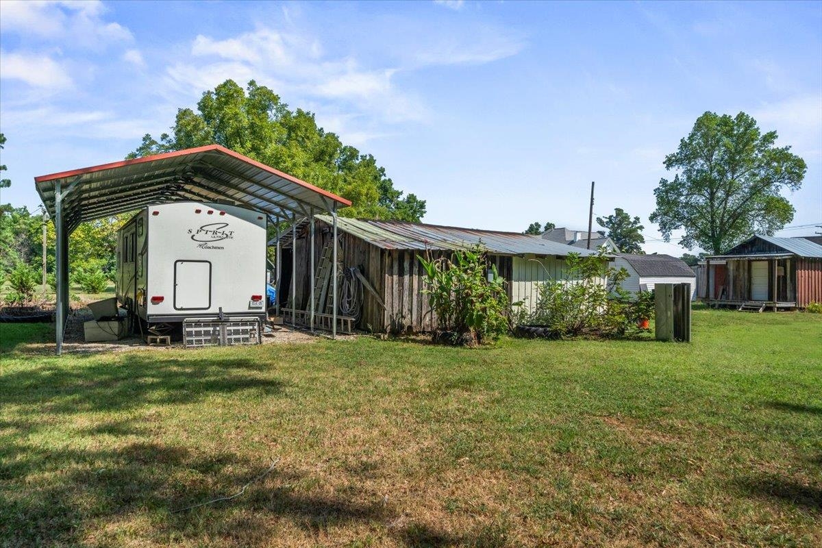 8703 Rosemark Road Millington, TN 38053 - Photo 36 of 38 a view of a house with a big yard and large trees