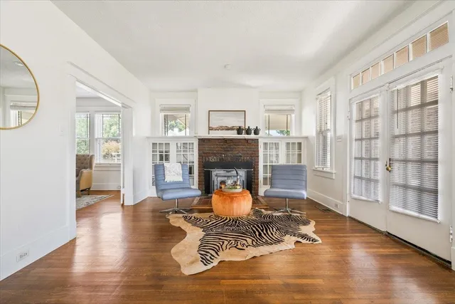 a living room with furniture and a fireplace