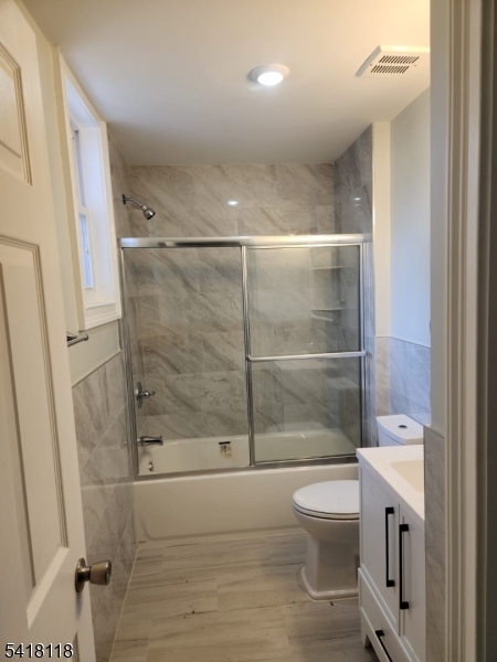 464 Walnut Street Elizabeth, NJ 07201 - Photo 12 of 22 a bathroom with a toilet and a shower