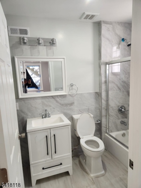 464 Walnut Street Elizabeth, NJ 07201 - Photo 20 of 22 a bathroom with a toilet sink and shower