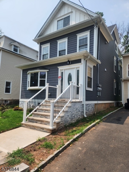 464 Walnut Street Elizabeth, NJ 07201 - Photo 2 of 22 a front view of a house with a yard