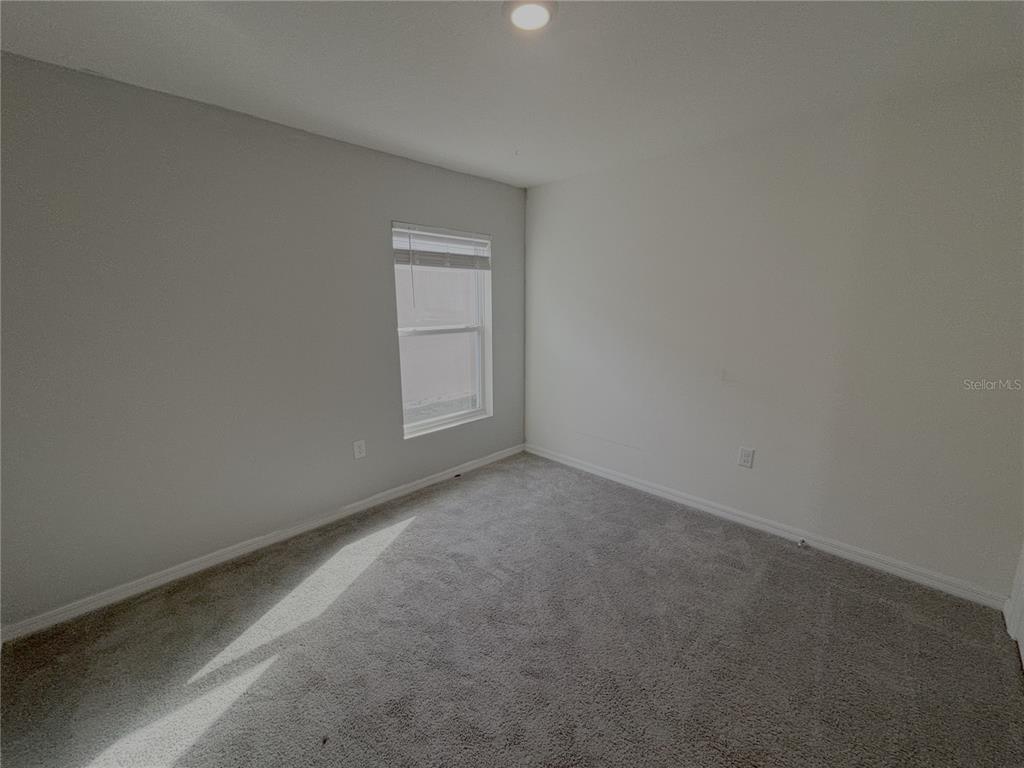 8940 Southwest 50th Terrace Ocala, FL 34476 - Photo 13 of 21 a view of an empty room and window