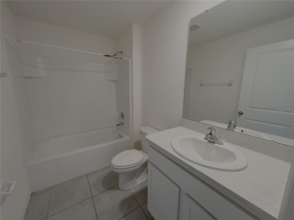 8940 Southwest 50th Terrace Ocala, FL 34476 - Photo 14 of 21 a bathroom with a sink toilet and shower