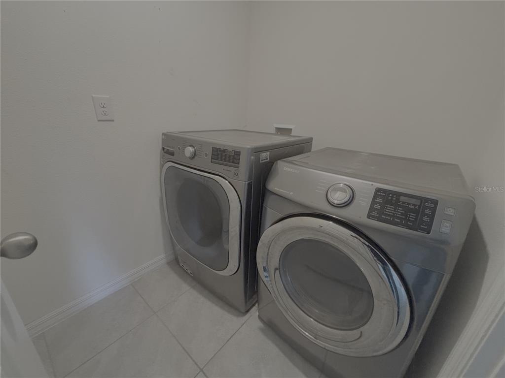 8940 Southwest 50th Terrace Ocala, FL 34476 - Photo 17 of 21 a utility room with dryer and washer