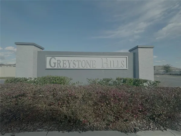 a sign broad in front of house