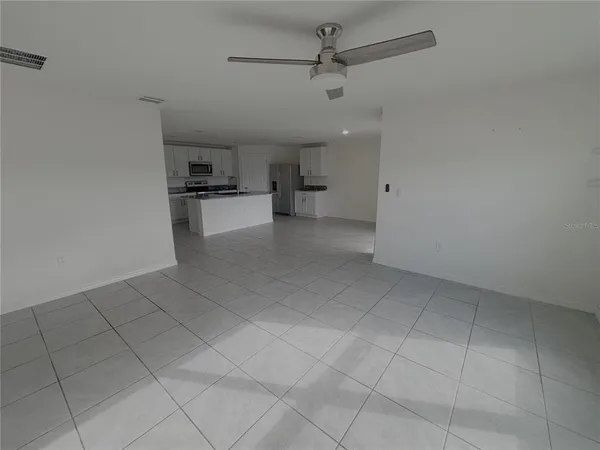 a view of a kitchen with a sink and cabinets