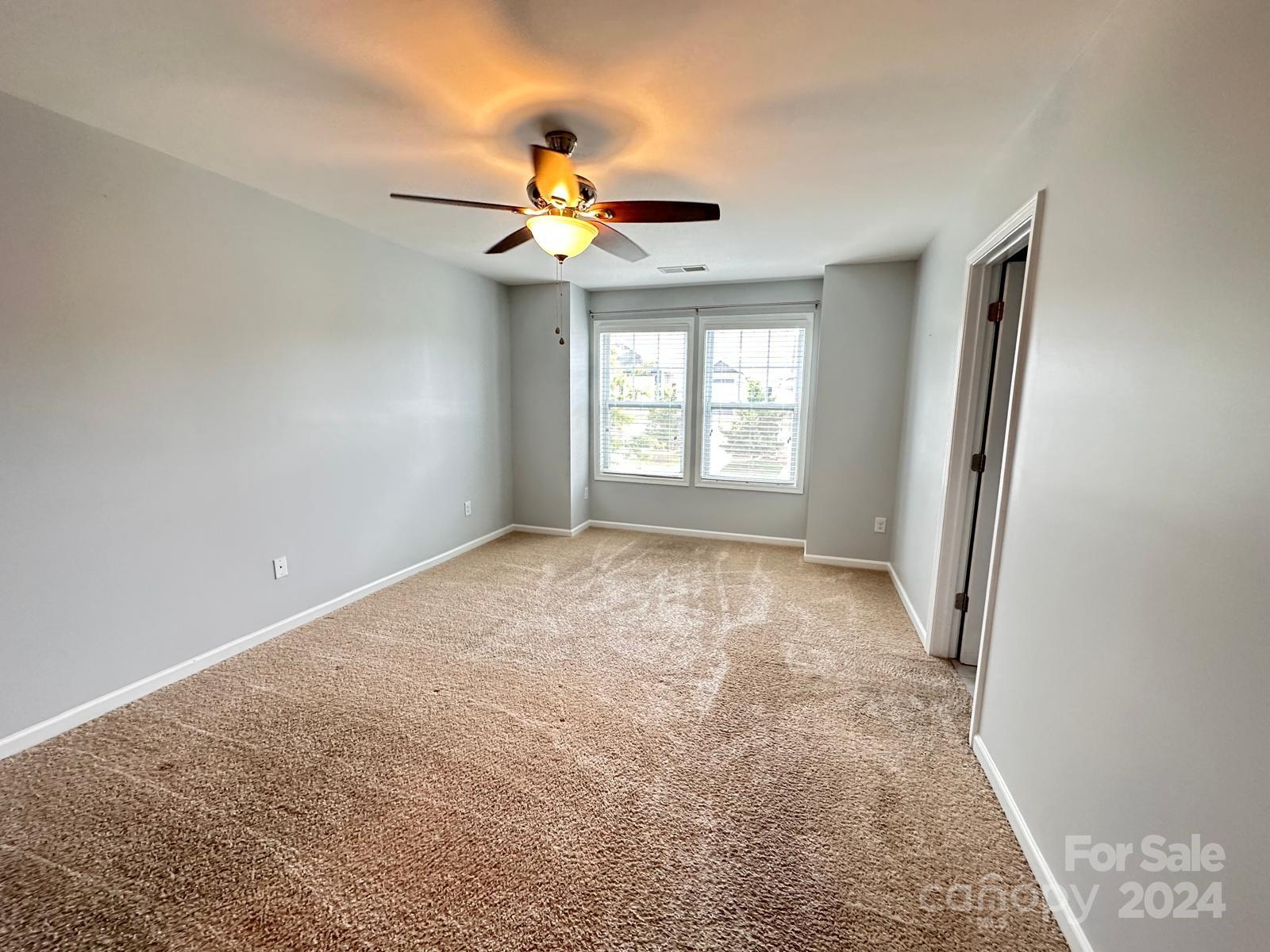 7040 Harris Bay Road Charlotte, NC 28269 - Photo 14 of 27 a view of an empty room with a window