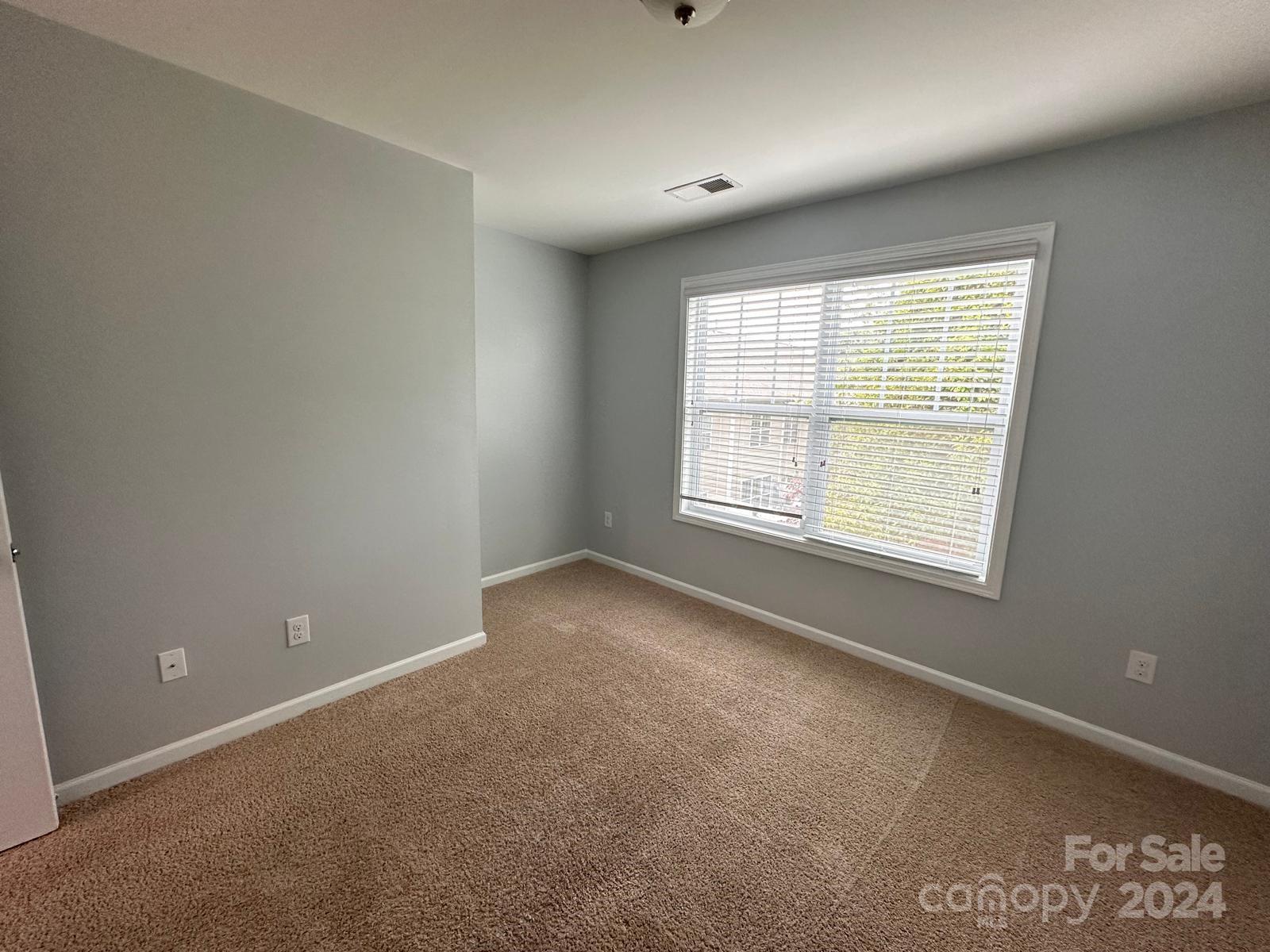 7040 Harris Bay Road Charlotte, NC 28269 - Photo 22 of 27 a view of an empty room with a window