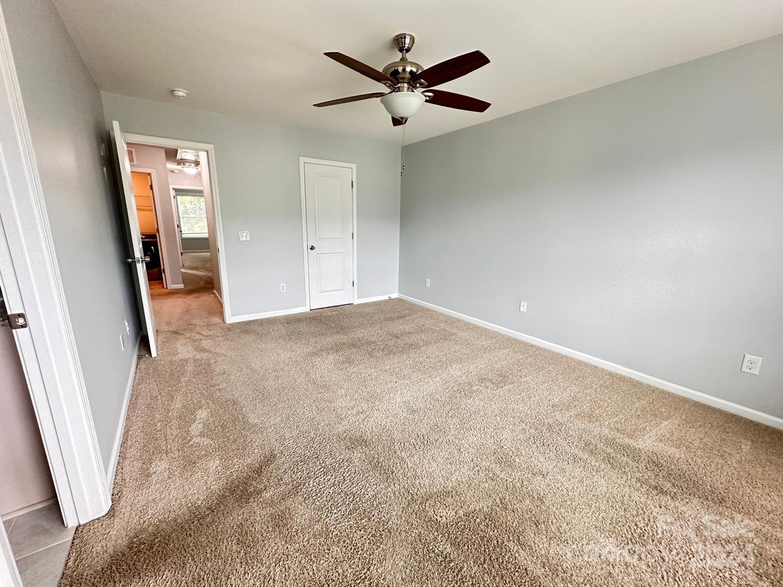 7040 Harris Bay Road Charlotte, NC 28269 - Photo 26 of 27 a view of a livingroom with a ceiling fan