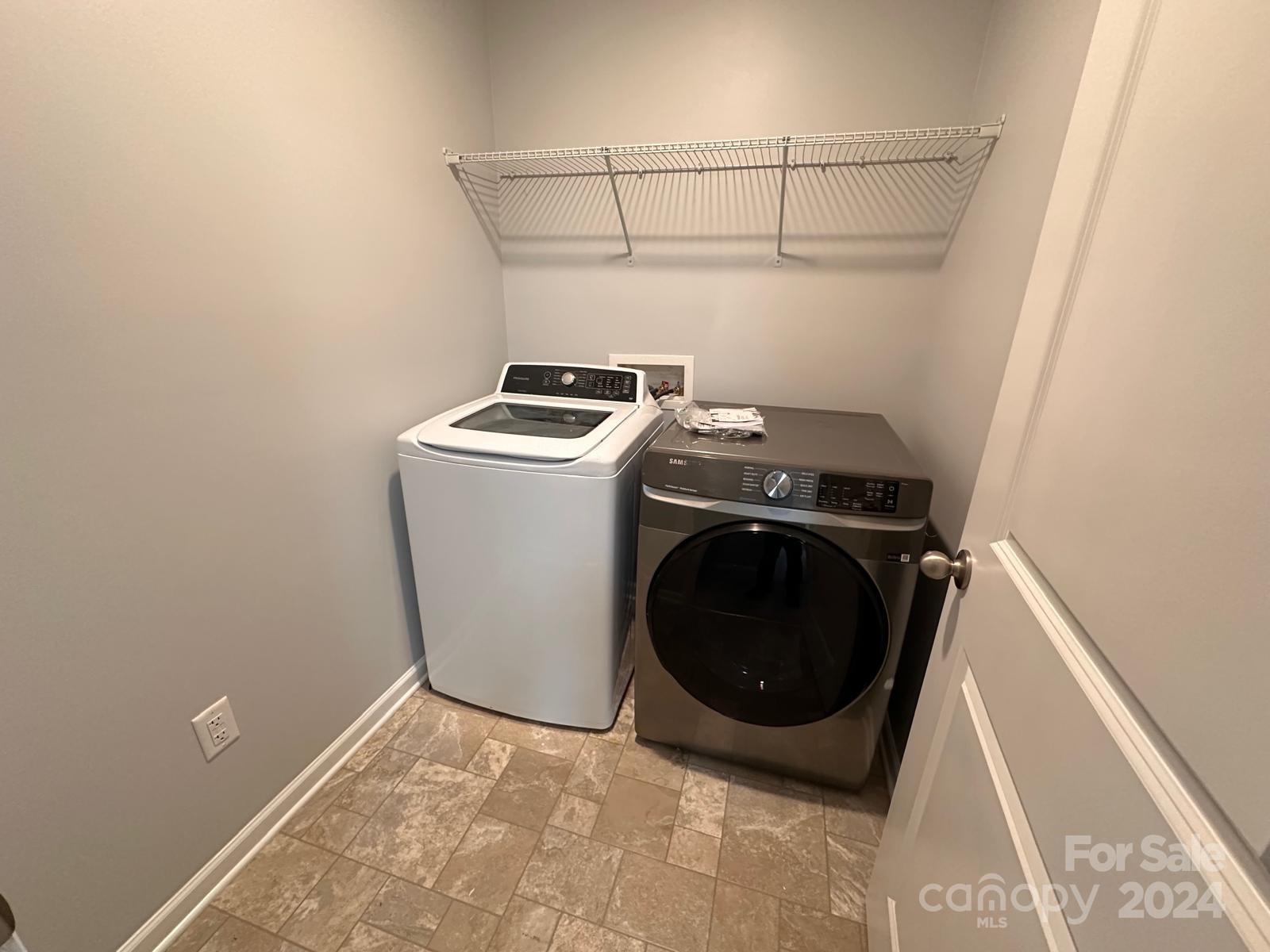 7040 Harris Bay Road Charlotte, NC 28269 - Photo 27 of 27 a utility room with dryer and washer