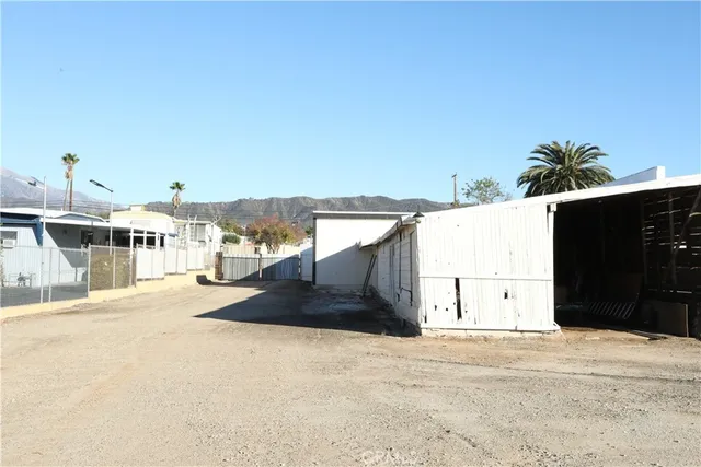 a view of a house with a yard and garage