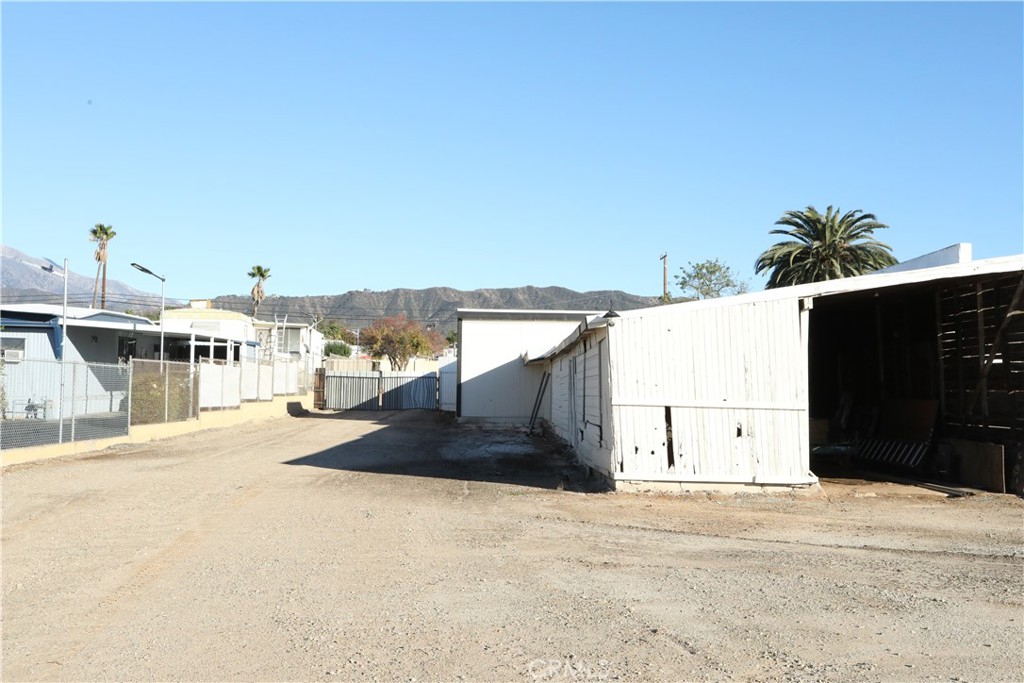 1002 California Street Calimesa, CA 92320 - Photo 14 of 14 a view of a house with a yard and garage