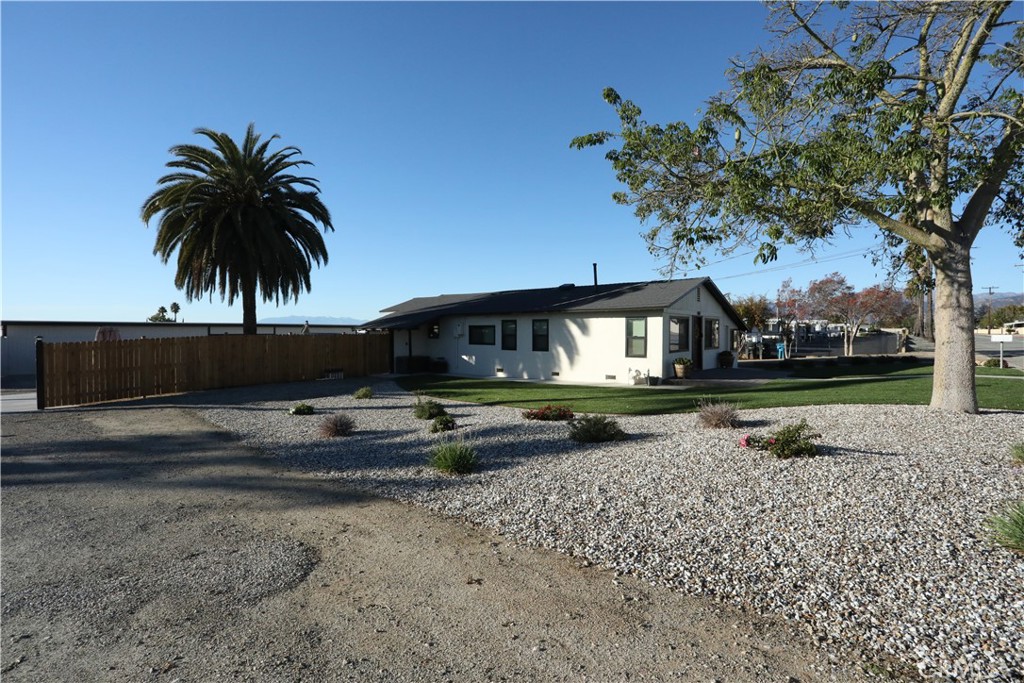 1002 California Street Calimesa, CA 92320 - Photo 5 of 14 a view of a house with a yard and sitting area