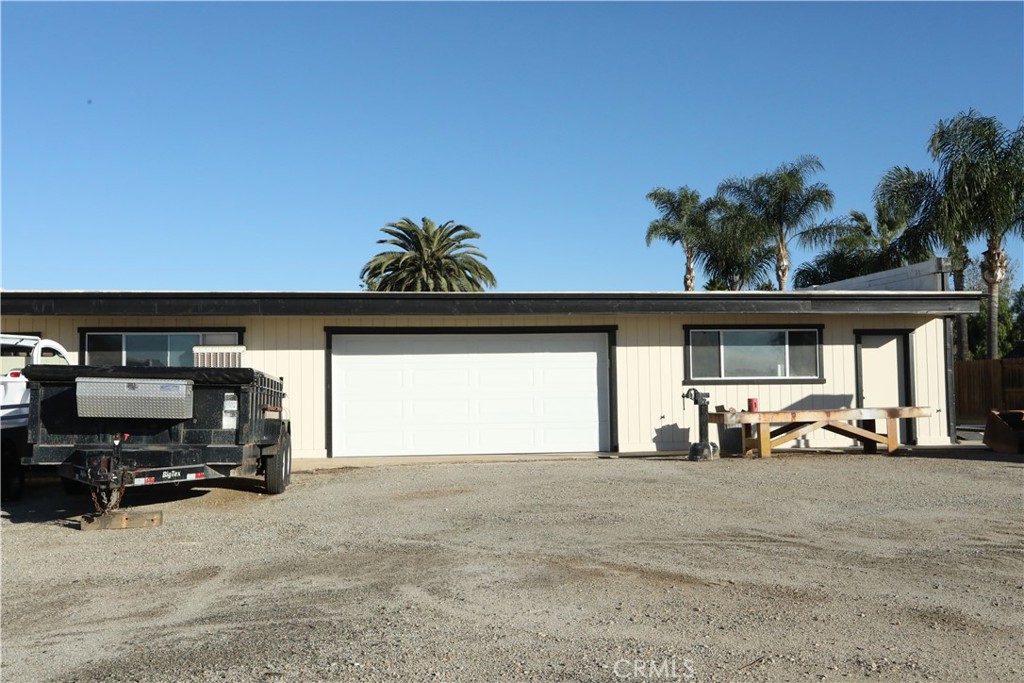1002 California Street Calimesa, CA 92320 - Photo 6 of 14 a view of car parked in front of garage