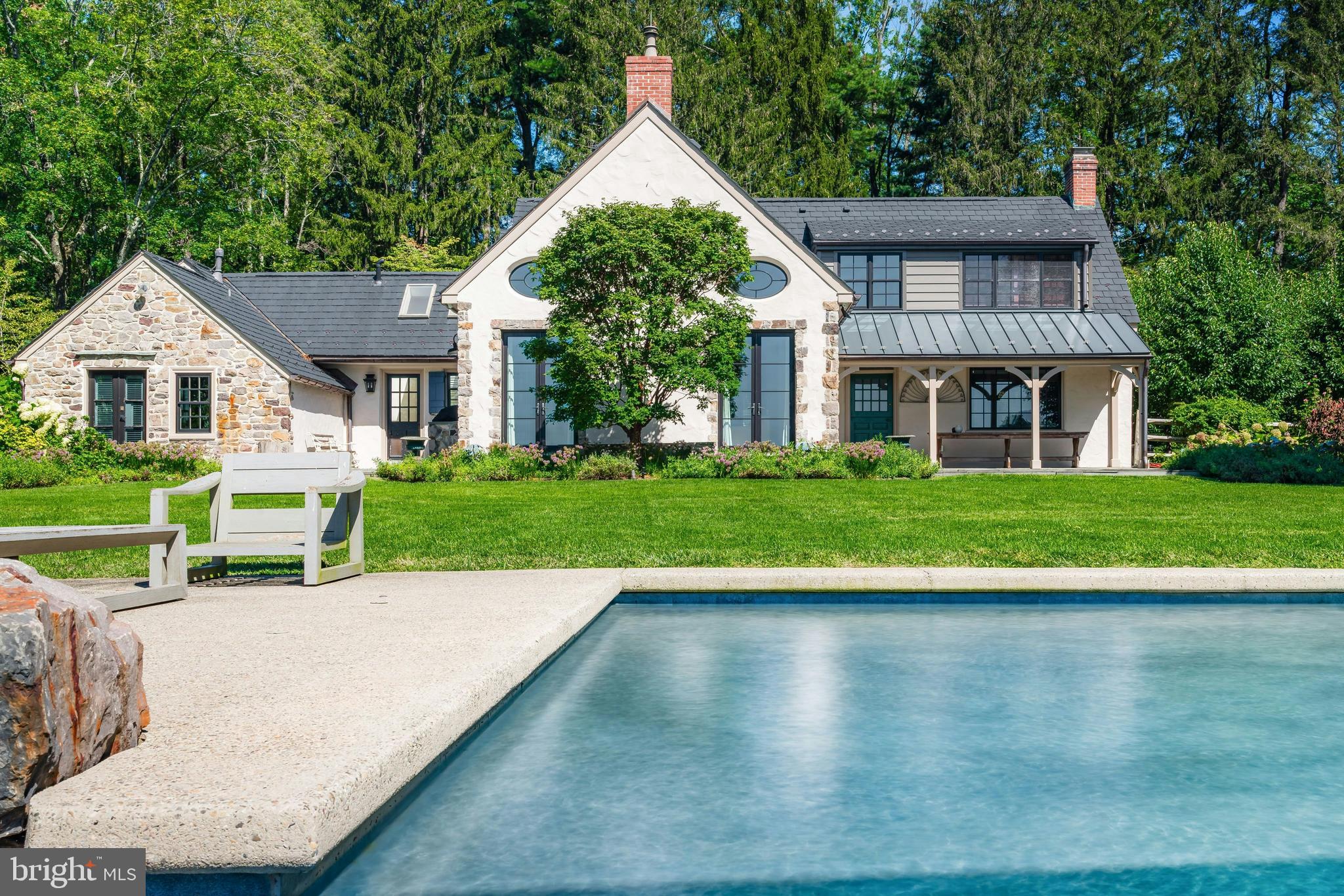 a view of a house with a yard and plants