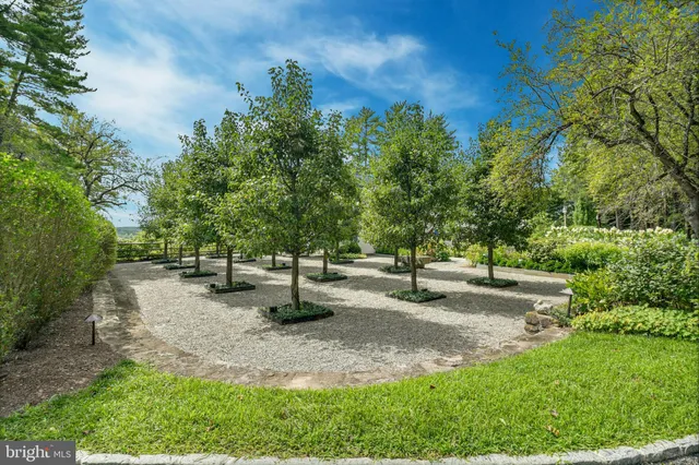 a large kitchen with cabinets and stainless steel appliances
