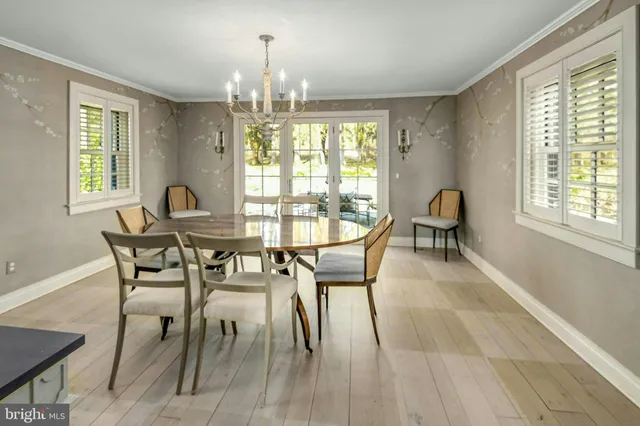 a kitchen with stainless steel appliances granite countertop lots of counter top space and wooden floor