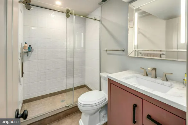 a swimming pool with outdoor seating and trees