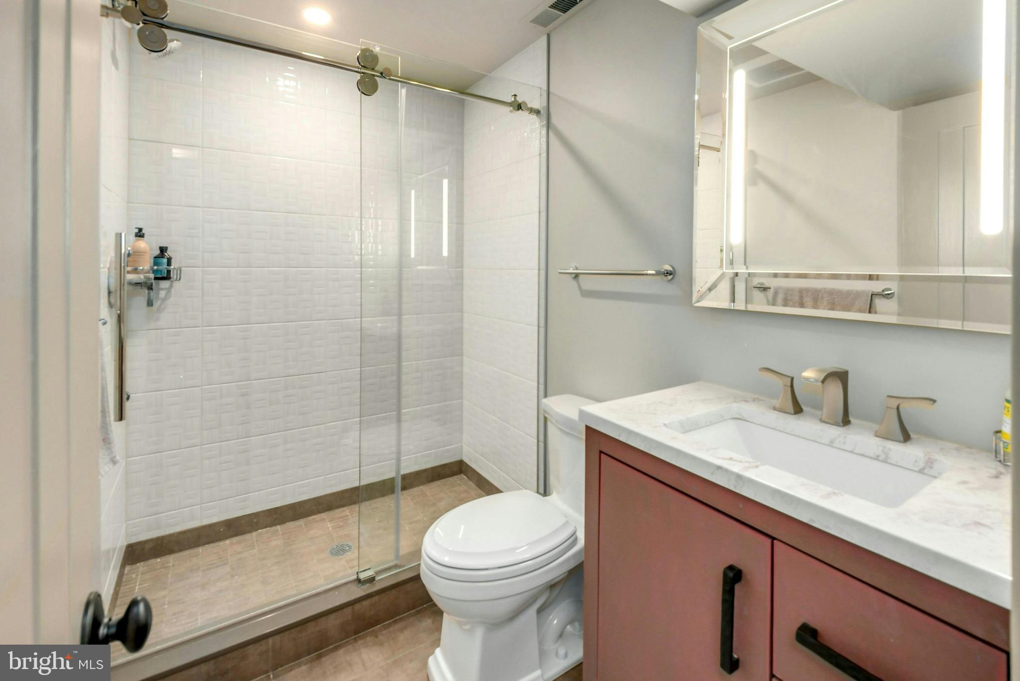 7043 Phillips Mill Road New Hope, PA 18938 - Photo 46 of 84 a bathroom with a sink a toilet and shower